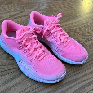 Women neon pink nike running shoes